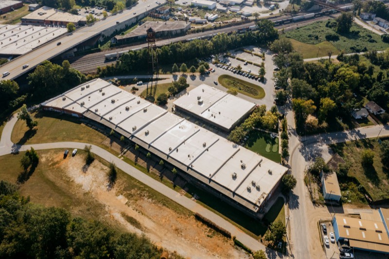 low commercial building with a long flat roof, seen from the air