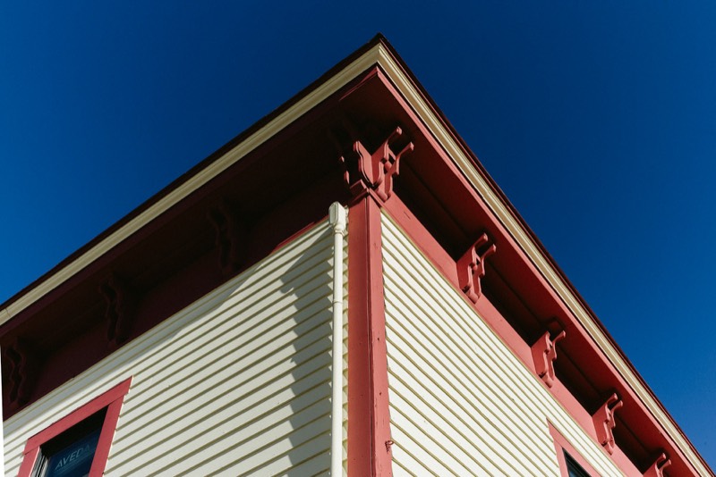 wood soffit, gutters and windows on a finished exterior